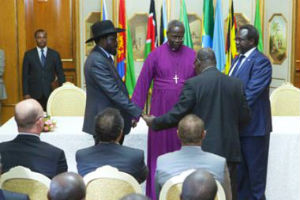 Salva Kiir and Riek Machar with two clergy members. Photo: AFP/Zacharias Abubeker