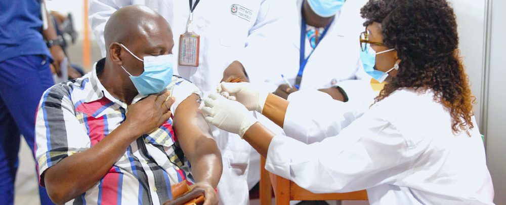 A man in Abidjan, Côte d'Ivoire, receives a COVID-19 vaccine. 