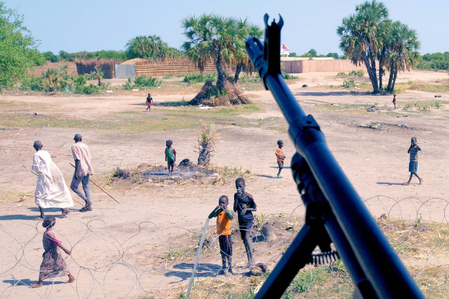 South Sudan civilians under a rifle