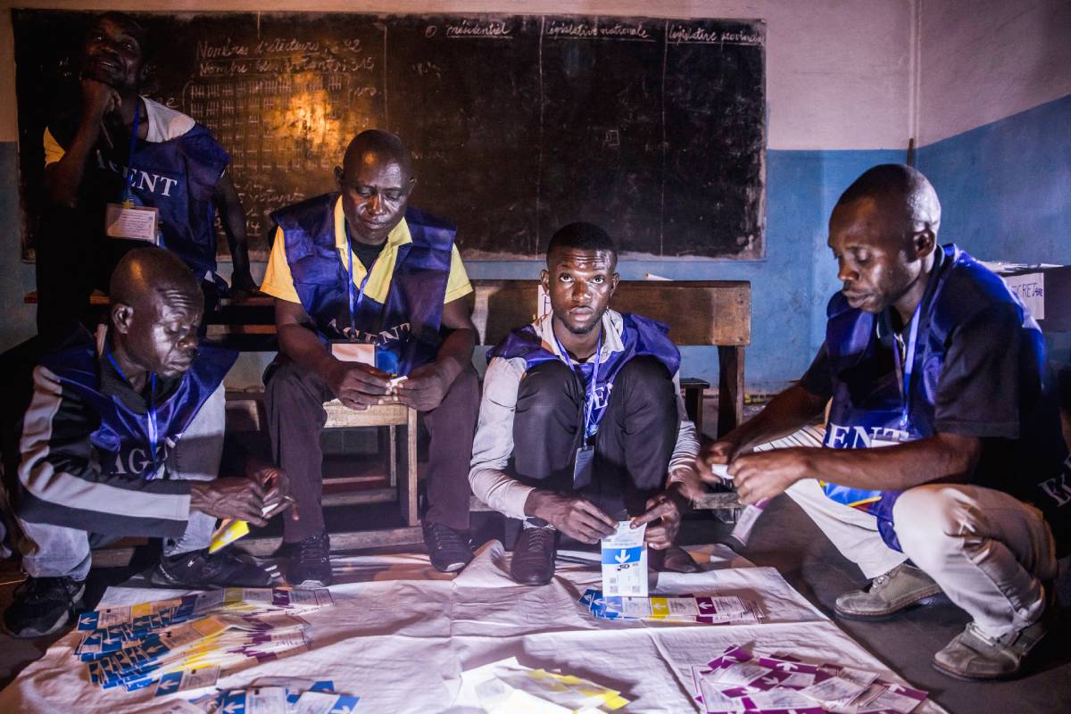 Polling officials count votes in a school in Kinshasa during the 2018 general elections.