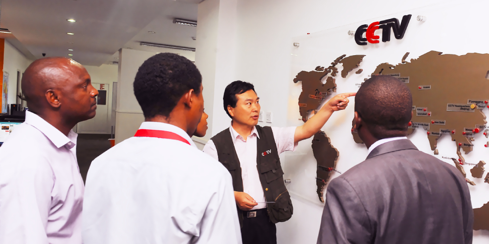 The managing editor of China Central Television (CCTV) talking to Kenyan journalists in Nairobi as he shows them how CCTV has expanded to different parts of Africa.