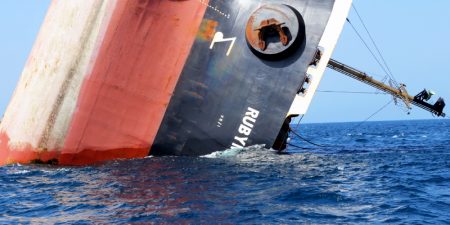 This picture taken on March 7, 2024 shows the Rubymar cargo ship partly submerged off the coast of Yemen. - The bulk carrier went down off Yemen after a Huthi missile attack and poses grave environmental risks as thousands of tonnes of fertiliser threaten to spill into the Red Sea, officials and experts warn. The Belize-flagged, Lebanese-operated Rubymar sank on Saturday with 21,000 metric tonnes of ammonium phosphate sulfate fertiliser on board, according to US Central Command. (Photo by Khaled Ziad / AFP)