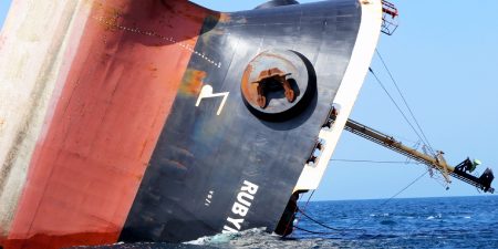This picture taken on March 7, 2024 shows the Rubymar cargo ship partly submerged off the coast of Yemen. - The bulk carrier went down off Yemen after a Huthi missile attack and poses grave environmental risks as thousands of tonnes of fertiliser threaten to spill into the Red Sea, officials and experts warn. The Belize-flagged, Lebanese-operated Rubymar sank on Saturday with 21,000 metric tonnes of ammonium phosphate sulfate fertiliser on board, according to US Central Command. (Photo by Khaled Ziad / AFP)