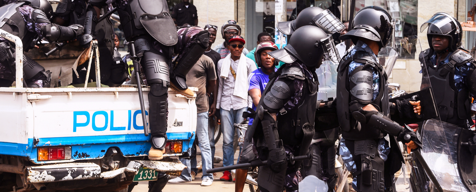 Anti-riot policemen warn protesters in Lomé ahead of the opposition-boycotted presidential election in February 2020.