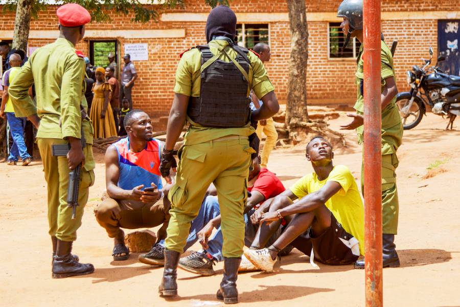 Tanzanian police officers surround a group of young voters following their arrest during the Tanzanian local election in November 2024. (Photo: AFP/Ericky Boniphace)