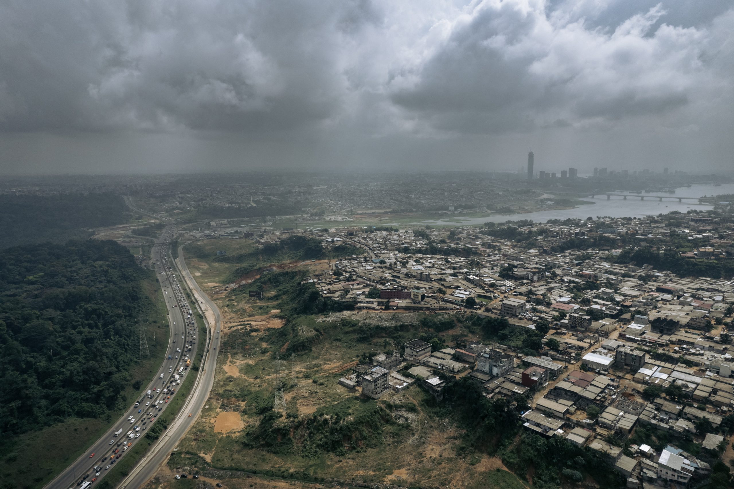 Aerial view of the Yopougon district beside a highway running to Abidjan, Côte d'Ivoire. Aerial view of the Yopougon district beside a highway running to Abidjan, Côte d'Ivoire.