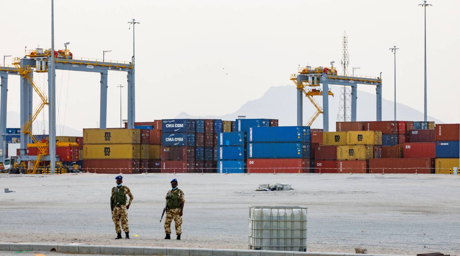 Berbera Port Two soldiers stand facing shipping containers at Berbera Port