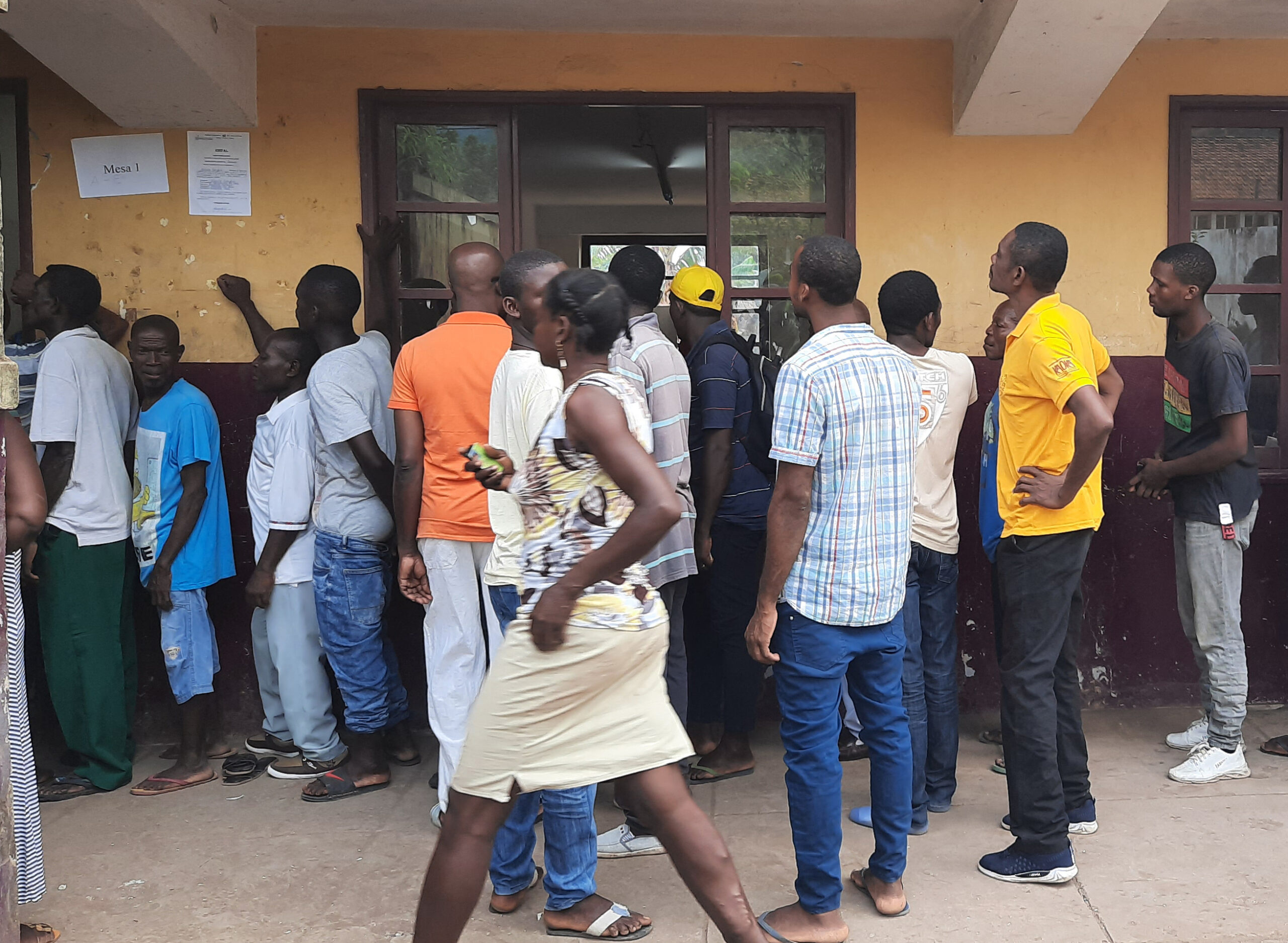 São Tomé and Príncipe citizens wait in line to vote. 