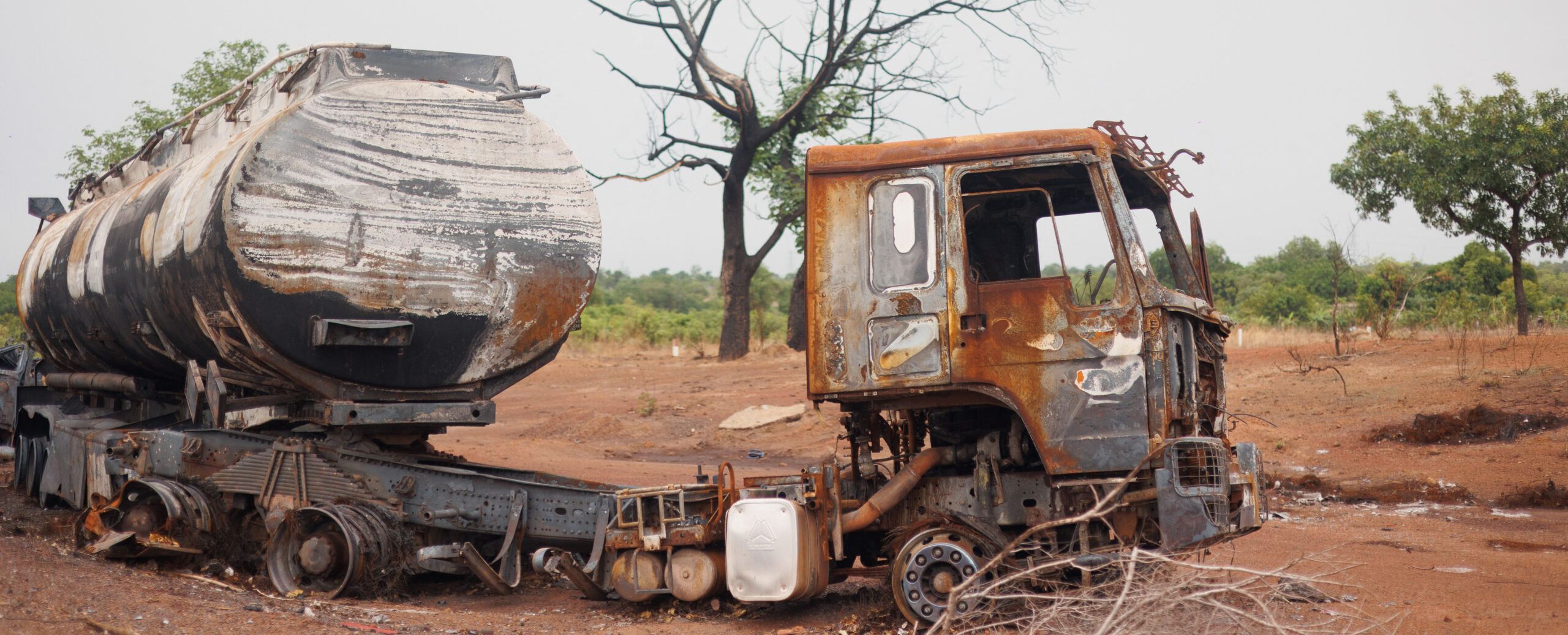 A fuel truck burned by militant Islamist groups is seen abandoned in the middle of the road leading to Sikasso on May 26, 2026. (Photo: AFP)